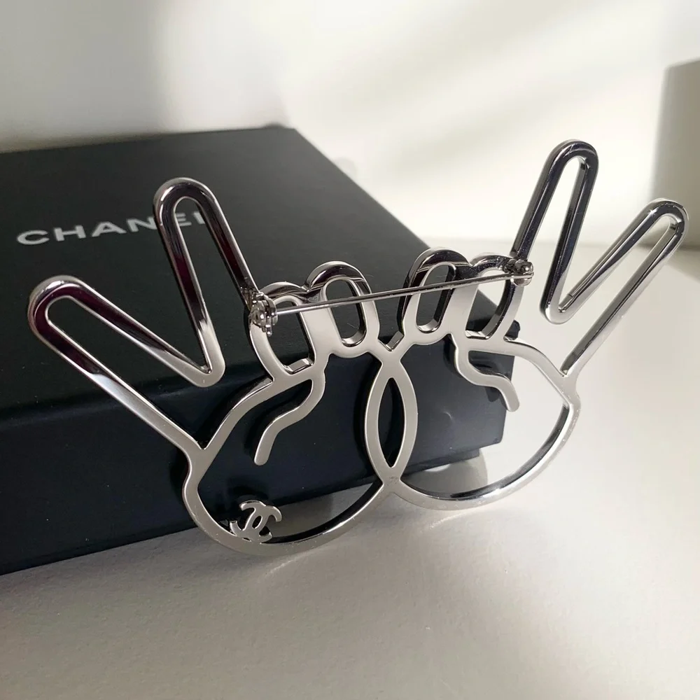Chanel large peace hands pin